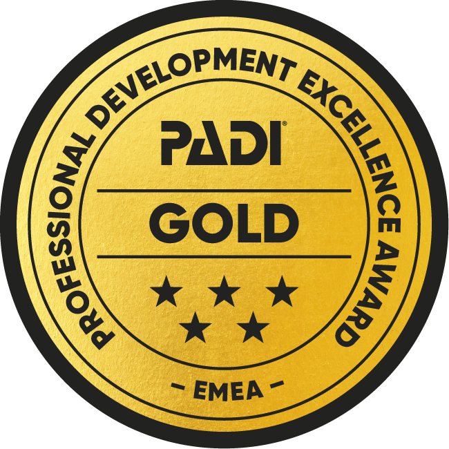 Gold PADI Professional Development Excellence Award badge with EMEA designation