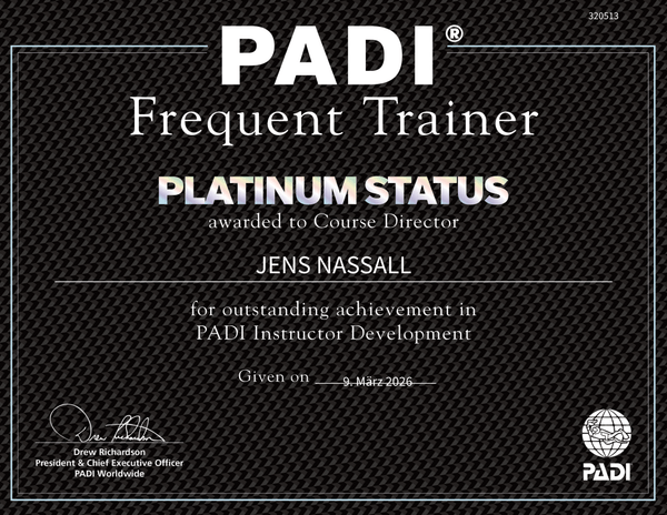 - diveXellence PADI Frequent Trainer Platinum Status certificate awarded to Jens Nassall for outstanding achievement in PADI Instructor Development, given March 9, 2026, with signatures and logos.